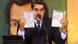 Nciolas Maduro holds up the passports of the two imprisoned men Nciolas Maduro holds up the passports of the two imprisoned men