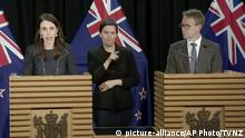 In this image from a video, New Zealand Prime Minister Jacinda Ardern, left, and Director-General of Health Ashley Bloomfield, right, attend a news conference in Wellington, New Zealand Tuesday, Aug. 11, 2020. Ardern says authorities have found four cases of the coronavirus in one Auckland household from an unknown source, the first cases of local transmission in the country in 102 days. (TVNZ via AP) |