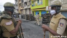 August 12, 2020***
Policeman look at burnt police vehicles in the sensitive area in Bangalore on August 12, 2020, after violence broke out overnight in Devara Jevana Halli area following a derogatory Facebook post about the Prophet Mohammed that sparked riots. - Two people died after a derogatory Facebook post about the Prophet Mohammed sparked riots in India's IT hub Bangalore that saw clashes between police and thousands of protesters, authorities said on August 12. At least 60 officers were injured the previous evening as a furious crowd attacked a police station, set vehicles on fire and burnt down the house of a local lawmaker whose nephew was allegedly responsible for the social media post. (Photo by Manjunath Kiran / AFP)