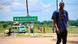 A man walks by the main entrance to Mocimboa da Praia A man walks by the main entrance to Mocimboa da Praia