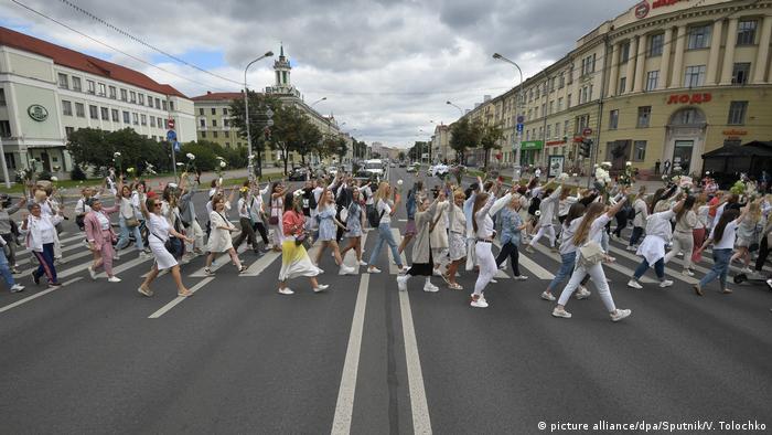 Women with flowers protest in Belarus