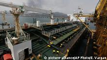 FILE - In this May 25, 2020***
file photo, the Iranian oil tanker Fortune is anchored at the dock of the El Palito refinery near Puerto Cabello, Venezuela. U.S. officials said Thursday, Aug. 13, 2020, that the Trump administration has seized the cargo of four tankers it was targeting for transporting Iranian fuel to Venezuela as it steps up its campaign of maximum pressure against the two heavily sanctioned. (AP Photo/Ernesto Vargas, File) |
