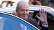 Spain's former king Juan Carlos I waving as he enters a car Spain's former king Juan Carlos I waving as he enters a car