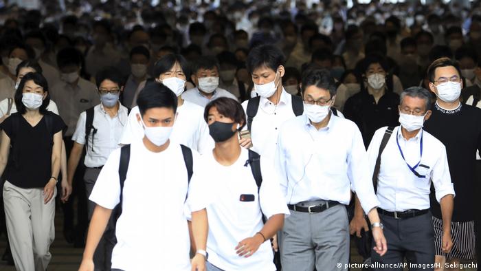 People wearing face mask are seen during commuting time at Shinagawa Station in Minato Ward, Tokyo
