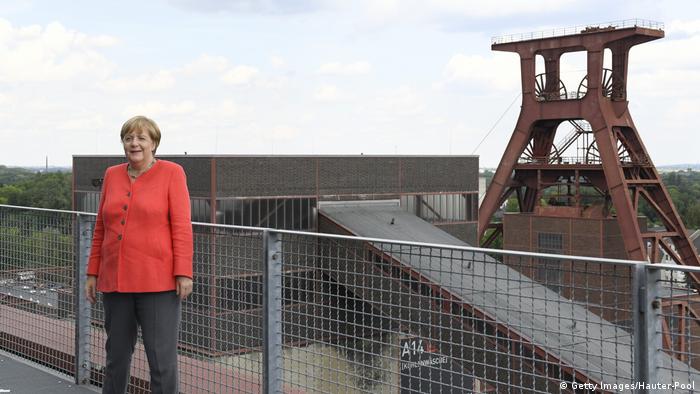 German Chancellor Angela Merkel visits a former coal mine