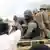 Malian soldiers on the back of a truck