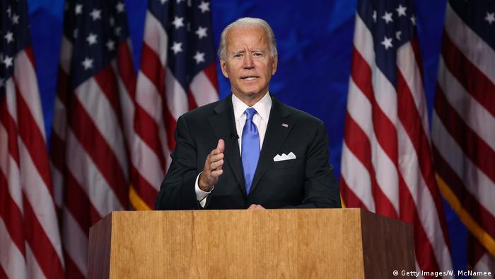 Joe biden holds out his hands as he speaks at the Democratic National Convention