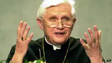 Head of the Vatican's Congregation for the Doctrine of the Faith Cardinal Joseph Ratzinger, gestures during a news conference at the Vatican Monday June 26, 2000. During the conference it was made public the entire handwritten text of the ''Third Secret of Fatima'' as set down by the sole surviving witness of the series of visions, Sister Lucia de Jesus dos Santos, now a 93-year-old cloistered nun. As first disclosed last month by cardinal Angelo Sodano, the Vatican reiterated that the proper interpretation of the so-called third secret was a foretelling of the 1981 assassination attempt against Pope John Paul II. (AP Photo/Massimo Sambucetti/POOL)