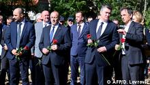 Croatian President Zoran Milanovic (2nd - R), Deputy Prime Minister and Minister of War Veterans Tom Medved ( 2 nd - L), Deputy Prime Minister of Croatia in charge of social affairs and human and minority rights Boris Milosevic (L) and President of the Serbian People's Party Milorad Pupovac (R) attends during the commemoration of the 25th anniversary of the killings of six Serb villagers, in the village of Plavno, near Knin in southern Croatia on August 25, 2020. - For the first time in 25 years, Croatian authorities are taking part in a commemoration in Plavno and Grubori, places where Serb civilians were killed. (Photo by Denis LOVROVIC / AFP)