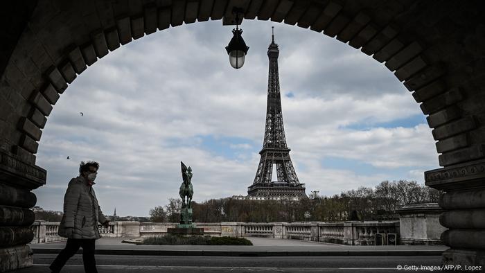 The Eiffel Tower in Paris, seen from under a nearby bridge 