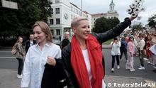 Belarusian opposition politician Maria Kolesnikova waves during a demonstration against police brutality following recent protests to reject the presidential election results in Minsk, Belarus August 29, 2020. BelaPAN via Reuters ATTENTION EDITORS - THIS IMAGE WAS PROVIDED BY A THIRD PARTY. NO RESALES. NO ARCHIVES. MANDATORY CREDIT