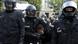 Police officer restrains a protester in Berlin Police officer restrains a protester in Berlin
