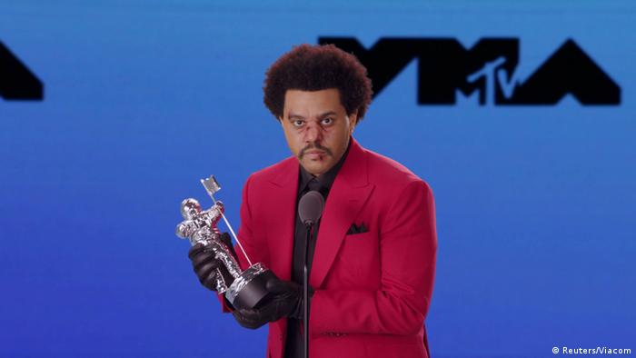 he Weeknd accepts the award for Best R&B