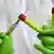 Needles show a mock coronavirus vaccine
