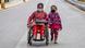 Shanti tamang, aged 32, in a wheelchair with her child, Rima tamang moving along a deserted road while wearing face masks as a precaution during lockdown Shanti tamang, aged 32, in a wheelchair with her child, Rima tamang moving along a deserted road while wearing face masks as a precaution during lockdown