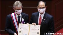 Czech senate president Milos Vystrcil receives a certificate for an award before delivering a speech at the main chamber of the Legislative Yuan in Taipei, Taiwan September 1, 2020. REUTERS/Ann Wang 