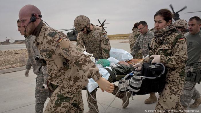 Bundeswehr soldiers transporting a wounded German soldier in Afghanistan