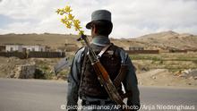 FILE - In this Wednesday, May 15, 2013 file photo made by Associated Press photographer Anja Niedringhaus, an Afghan National Police officer mans a checkpoint in the outskirts of Maidan Shahr, Wardak province, Afghanistan. Niedringhaus, 48, an internationally acclaimed German photographer, was killed and an AP reporter was wounded on Friday, April 4, 2014 when an Afghan policeman opened fire while they were sitting in their car in eastern Afghanistan. (AP Photo/Anja Niedringhaus, File) |