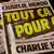A cover of French satirical weekly Charlie Hebdo reads "All of this, just for that," to mark the start of the trial for the 14 accused in the attacks