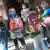Schoolchildren with satchels on their backs