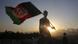 A man waves an Afghan flag during Independence Day celebrations in Kabul A man waves an Afghan flag during Independence Day celebrations in Kabul