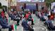 Iranian students practice social distancing while seated in the school grounds Iranian students practice social distancing while seated in the school grounds