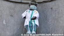 05.09.2020
TOPSHOT - This photograph taken on September 5, 2020 shows the 'Manneken Pis' statue wearing a uniform with a protective mask and face shield to honour the healthcare staff, in Brussels. (Photo by NICOLAS MAETERLINCK / BELGA / AFP) / Belgium OUT (Photo by NICOLAS MAETERLINCK/BELGA/AFP via Getty Images)