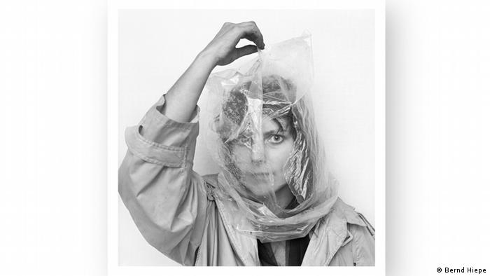 Woman with plastic bag over her head 
