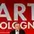 Director Daniel Hug stands in front of an Art Cologne sign