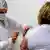 A Brazilian doctor receives the coronavirus vaccine