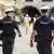 Two officers from the Munich Police patrol Marienplatz for assorted criminality as well as unsafe behavior that can transmit Coronavirus