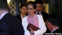 FILE PHOTO: Myanmar's leader Aung San Suu Kyi leaves the International Court of Justice (ICJ), the top United Nations court, after court hearings in a case against Myanmar alleging genocide against the minority Muslim Rohingya population, in The Hague, Netherlands December 12, 2019. REUTERS/Eva Plevier/File Photo