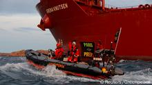 Greenpeace activists hold a banner as they try to block the passage for an oil tanker approaching a Swedish refinery in Lysekil, Sweden September 10, 2020. Greenpeace - Andrew McConnell/Handout via REUTERS THIS IMAGE HAS BEEN SUPPLIED BY A THIRD PARTY. MANDATORY CREDIT. NO RESALES. NO ARCHIVES.