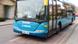 An Arriva bus arrives at a bus stop. An Arriva bus arrives at a bus stop.