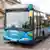 An Arriva bus arrives at a bus stop.
