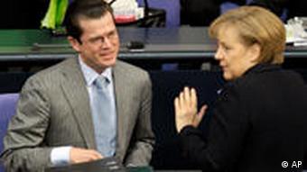 Karl-Theodor zu Guttenberg and Angela Merkel