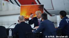 US President Donald Trump speaks during a briefing on wildfires with local and federal fire and emergency officials at Sacramento McClellan Airport in McClellan Park, California on September 14, 2020. (Photo by Brendan Smialowski / AFP)