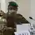 Colonel Assimi Goita wears a mask and military uniform as he attends an ECOWAS meeting in September 2020