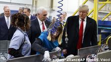 President-elect Donald Trump and Vice President-elect Mike Pence watch as employees work during a visit to Carrier factory, Thursday, Dec. 1, 2016, in Indianapolis, Ind. (AP Photo/Evan Vucci) |