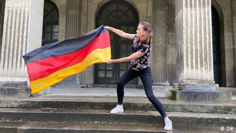 Rachel Stewart holding a German flag