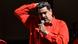 Nicolás Maduro, com uma mão na cabeça e outra no microfone Nicolás Maduro, com uma mão na cabeça e outra no microfone