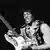 Black-and-white picture of Jimi Hendrix with his guitar