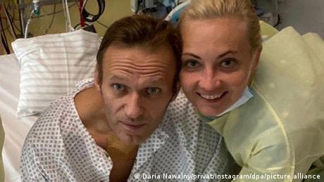 Navalny and his wife pictured in the Charite hospital