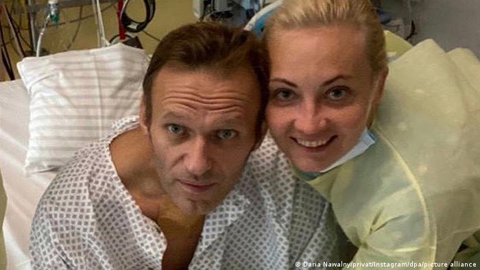 Navalny and his wife pictured in the Charite hospital