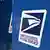 A blue USPS mailbox