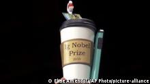 FILE - In this Sept. 12, 2019, file photo, the 2019 Ig Nobel award is displayed at the 29th annual Ig Nobel awards ceremony at Harvard University in Cambridge, Mass. The spoof prizes for weird and sometimes head-scratching scientific achievement will be presented online in 2020 due to the coronavirus pandemic. (AP Photo/Elise Amendola, File) |