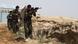 Afghanistan ANDSF fighters with machine guns in the desert Afghanistan ANDSF fighters with machine guns in the desert