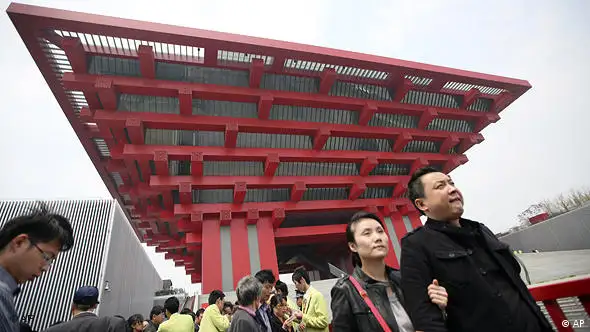 Visitors wait in queue to enter the China Pavilion at the World Expo site on the trial day Friday, April 23, 2010 in Shanghai, China. Shanghai's Expo, which opens on May 1, is likely to be the largest World's Fair ever, with some 70 million visitors expected to attend in the six months before it closes on Oct. 31. (AP Photo/Eugene Hoshiko)
