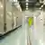 A man in a yellow safety suit walks through the Fordow facility in Iran