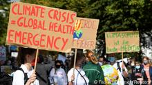 Demonstrators hold signs as Fridays for Future activists protest calling for a Global Day of Climate Action in Hamburg, Germany, September 25, 2020. REUTERS/Fabian Bimmer